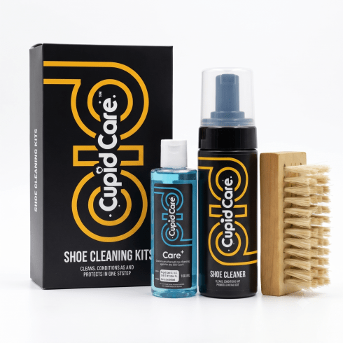 CupidCare Shoe Cleaning Kit with a black and yellow branded box, a blue liquid bottle, a black spray bottle, and a wooden cleaning brush on a white background.